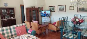 a living room with a couch and chairs and a table at Dream House by Douro Valley in Rio Mau +23 photos