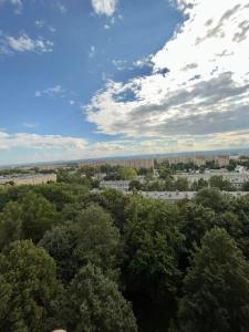 an overhead view of a city with trees and buildings at Panorama Apartment Kraków in Krakow