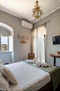 a bedroom with a large bed with towels on it at Ziolì in Noto