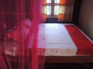 A bed or beds in a room at Bunyong Homestay