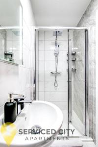 a bathroom with a shower and a white sink at SCA - Smart Studio - VS2 in Wolverhampton