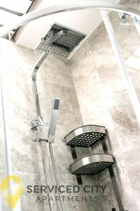 a bathroom with a walk in shower with at SCA - Smart Studio - VS2 in Wolverhampton