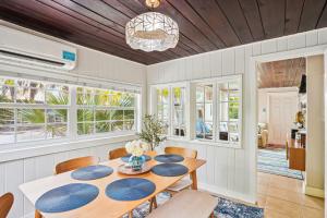 a dining room with a table and chairs at Beach House on the Sand in St Pete Beach