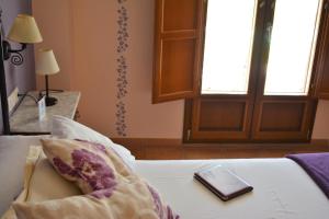 Łóżko lub łóżka w pokoju w obiekcie Hotel Posada San Marcos, Alájar