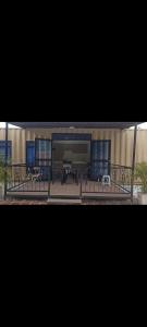 a building with a piano and benches in front of it at Charming Village, Tiny House in Santa Marta