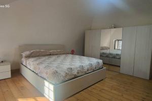 Giường trong phòng chung tại Pompei Casa Vacanza Priscus IV