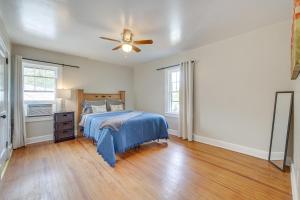 a bedroom with a bed and a ceiling fan at Welcoming Home in Youngstown with Private Backyard! in Youngstown