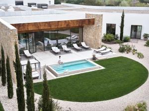 an aerial view of a house with a swimming pool at Camiral Golf & Wellness - Leading Hotel of the World in Caldes de Malavella