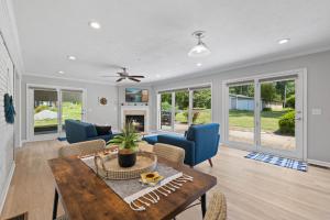 a living room with a table and chairs at Work-friendly & near downtown in Jeffersonville