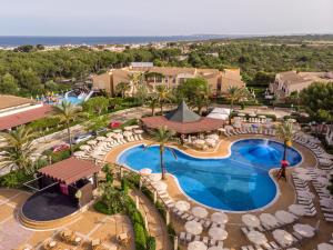 an aerial view of a resort with a swimming pool at Zafiro Menorca in Cala en Bosc