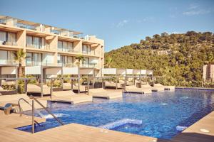a hotel with a swimming pool and a resort at Zafiro Palace Andratx in Camp de Mar