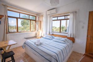 Voodi või voodid majutusasutuse Hostal Galapagos by Bar de Beto toas