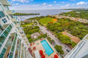 an aerial view of a building with a swimming pool at Modern 1-BD Arya Condo - Coconut Grove w-Pool & Parking in Miami