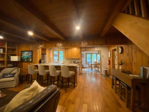 a kitchen and living room with a table and chairs at FamilyfunCabin in Tahoma