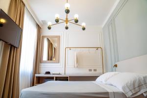 Voodi või voodid majutusasutuse Albergo Bianchi Stazione toas