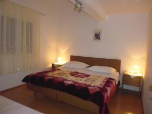 Postel nebo postele na pokoji v ubytování Apartments Jadranka Povile