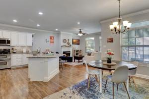a kitchen and living room with a table and chairs at Waterfront Lake Hamilton Getaway with Boat Ramp! in Hot Springs