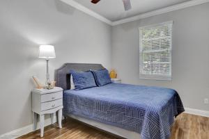a white bedroom with a bed and a window at Waterfront Lake Hamilton Getaway with Boat Ramp! in Hot Springs