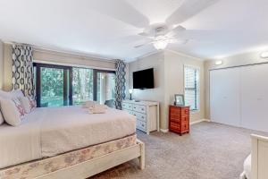 a bedroom with a bed and a ceiling fan at High Hammock 171 in Seabrook Island