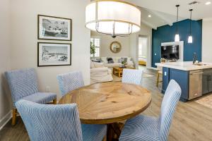 a dining room and living room with a table and chairs at Naples Retreat with Community Perks 6 Mi to Beach! in Naples +19 photos
