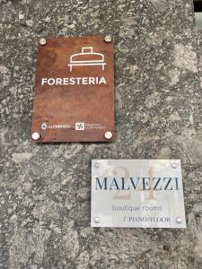 a sign for a train station on a stone counter at Malvezzi24 Boutique Rooms in Desenzano del Garda