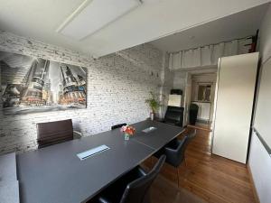 a meeting room with a large table and chairs at Business apartment in Berlin in Berlin