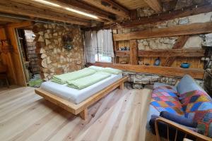 a room with a bed and a couch in a cabin at Wohnen im Denkmal. Erholung pur. in Sulz am Neckar