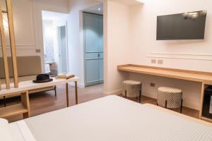 Televiisor ja/või meelelahutuskeskus majutusasutuses Albergo Bianchi Stazione