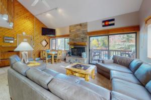 a living room with a couch and a fireplace at Pine Ridge 05E in Breckenridge