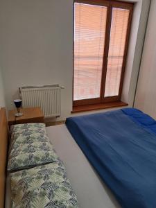 Кровать или кровати в номере Apartament in the center of Poprad-free parking