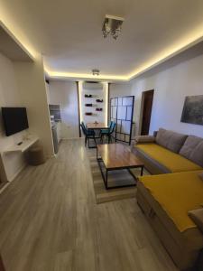 a living room with a couch and a table at JOANDI Apartments Gevgelija in Gevgelija