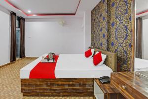 Tempat tidur dalam kamar di Flagship Hotel Rewal Palace Inn