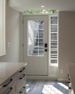 a kitchen with a white door with a window at The Croft House - 2 Bedroom 1 Bathroom Suite in Burlington