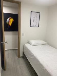 Postel nebo postele na pokoji v ubytování Magnífico Apto. Cerca de todo + 14 fotografií