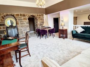 a living room with a couch and a table at Hamilton - Lord William in Scorton