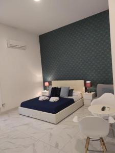 Letto o letti in una camera di DOMUS LUIGI LEONE 2