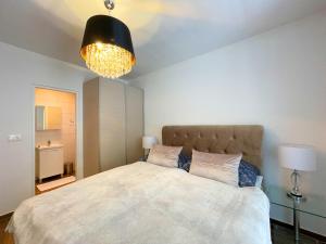 Кровать или кровати в номере Villa Olivija-direkt am Strand!