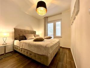 Кровать или кровати в номере Villa Olivija-direkt am Strand!