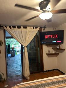 a door with a netflix sign and a curtain at Casa Miura Hotel Boutique in Ajijic