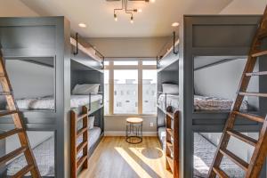 a room with four bunk beds and a window at Nashville Townhome with Rooftop Balcony and Game Room! in Nashville