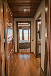a hallway with a room with a bed and a window at Rigat Park & Spa Hotel - Adults Recommended in Lloret de Mar