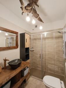 a bathroom with a sink and a shower at Appartamento lake-side in Calceranica al Lago