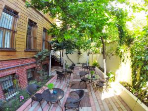 a patio with tables and chairs and a building at Ottoman's Pearl Hotel in Istanbul