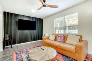 a living room with a couch and a flat screen tv at Pet Friendly Casa Nueve St Augustine Home! in Saint Augustine