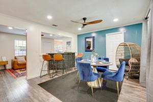 a dining room and living room with a table and chairs at Pet Friendly Casa Nueve St Augustine Home! in St. Augustine