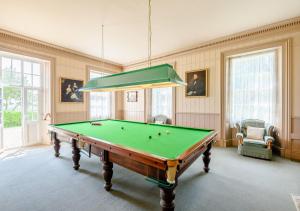a billiard room with a pool table in it at Grenville - Upcott House in Barnstaple