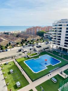 an overhead view of a swimming pool in a city at PATACONA PREMIUM PENTHOUSE Sea views & Barbecue in Valencia