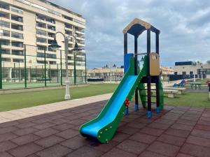 a playground with a slide in a park at PATACONA PREMIUM PENTHOUSE Sea views & Barbecue in Valencia