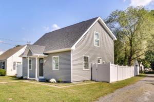 a house with a white fence in front of it at Updated Home - Walk to Salisbury University! in Salisbury