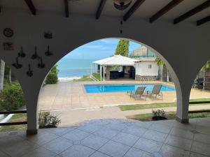 an archway in a house with a swimming pool at Coronado Beachfront tropical home! in Playa Coronado